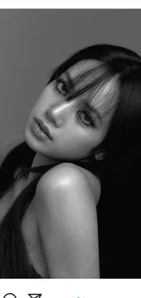 This live wallpaper for your phone showcases a black and white portrait photograph of a captivating woman with long hair and white bangs
