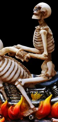 This live wallpaper showcases a digital figurine of two skeletons riding a motorcycle in hell