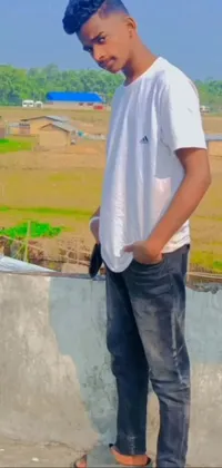 This phone live wallpaper features a young man on a skateboard ramp against a village background in a dynamic tachisme style