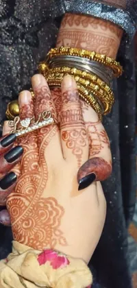 This exquisite live wallpaper features a close-up of intricately designed hands adorned with beautiful henna tattoos