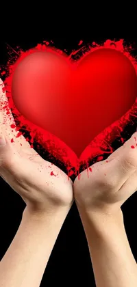 This stunning phone live wallpaper features a high resolution, computer generated image of a person holding a bright red heart