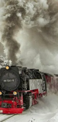 This phone live wallpaper depicts a train travelling through a snowy landscape, emitting huge puffs of smoke from its chimneys