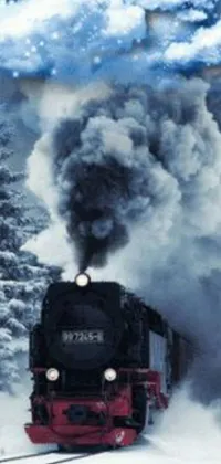 This live wallpaper features a train in a snowy landscape with smoke coming out of its chimneys