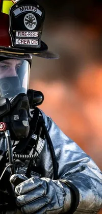 This live wallpaper depicts a firefighter in full protective gear, including helmet and suit