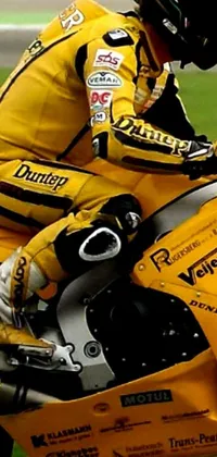 This exciting phone live wallpaper features a vibrant, yellow motorcycle and its rider