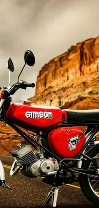 This live wallpaper for your phone showcases a striking red motorcycle parked on the roadside, featuring a stunning 70s photo-style inspired design