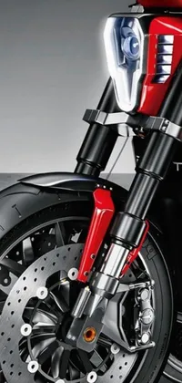 Looking for an electrifying phone wallpaper? Check out this close-up of a front wheel of a motorcycle