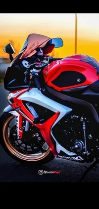 This phone live wallpaper showcases a red and black motorcycle featured on Reddit