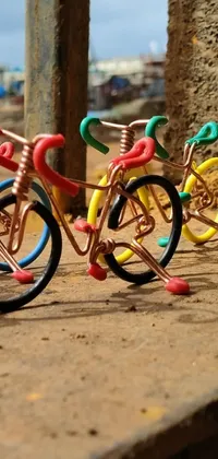 This live phone wallpaper features two colorful toy bikes modeled after those ridden by characters in a popular anime series