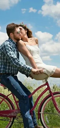 This live wallpaper features a romantic scene of a man riding on the back of a woman on a bike