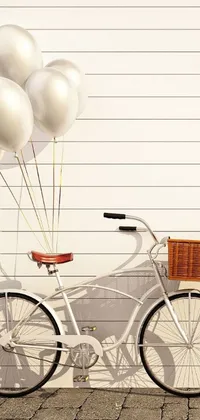 This phone live wallpaper portrays a vintage bicycle with a basket of balloons, rendered in ambient occlusion with a white plank siding background