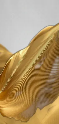 This stunning phone live wallpaper features a close up of gold fabric blowing in the wind against a gold tinted background of moving circles and lines