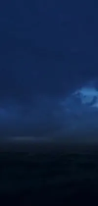 Experience a breathtaking thunderstorm at sea with this stunning live phone wallpaper