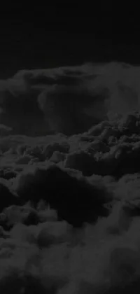 This phone live wallpaper features a captivating black and white photo of textured stormclouds with an album cover at the center