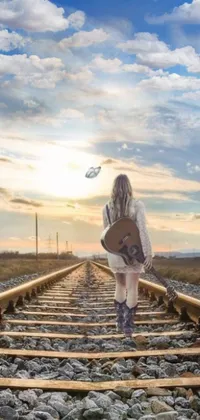 This mesmerizing phone live wallpaper features a woman walking down a train track as she strums her guitar