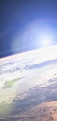 This phone live wallpaper captures a beautiful view of the earth as seen from a high flying airplane