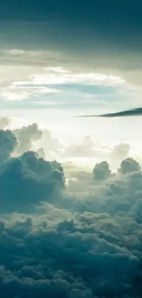 This live wallpaper showcases a high-flying airplane set against a backdrop of gorgeous cumulus clouds