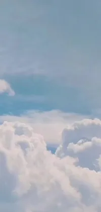 This lively live wallpaper features a jetliner soaring through a cloudy blue sky, surrounded by fluffy white clouds