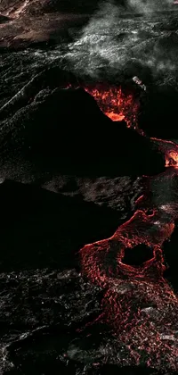 This phone live wallpaper features an aerial view of lava flowing into the ocean, with bold red typography in the corner