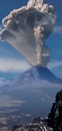 Set your phone ablaze with this vivid live wallpaper - featuring a towering mountain wreathed in a thick plume of smoke - drawing inspiration from National Geographic footage, with a dash of Mexican flair