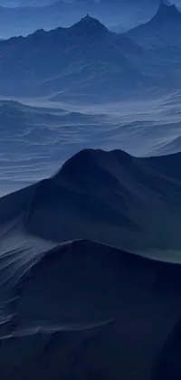 This live wallpaper showcases the scenic view of mountains from an airplane, transformed into a conceptual piece of art