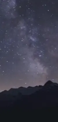 This live phone wallpaper depicts a stunning night sky filled with twinkling stars