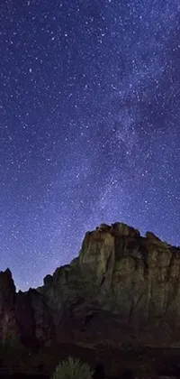 Admire the beauty of the night sky with this live wallpaper! Featuring Sedona's Cathedral Rock Bluff, it showcases a stunningly clear night sky filled with stars and planets