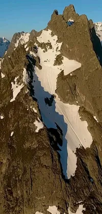 This live phone wallpaper captures a skilled snowboarder carving his way down a snow-covered mountain in Washington