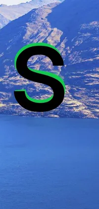 This mountain and lake animated phone wallpaper features the letter "s" in green and blue