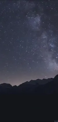Get lost in the beauty of the night sky with our stunning phone live wallpaper featuring a mountain scape and lots of twinkling stars