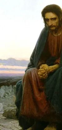 This cellphone live wallpaper portrays a painting of Jesus sitting on a rock with a sorrowful expression, fine art with and rays of light behind him
