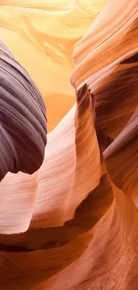 This phone live wallpaper showcases a magnificent rock formation in a canyon with an orphism style