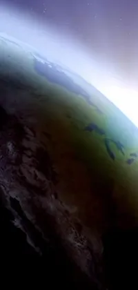 This phone live wallpaper features an animated view of the earth from space with worm's eye view from the floor perspective