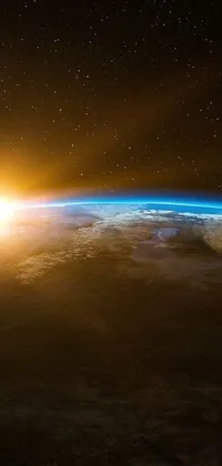 Experience the beauty of earth from space with this stunning phone live wallpaper featuring a sunrise over our planet