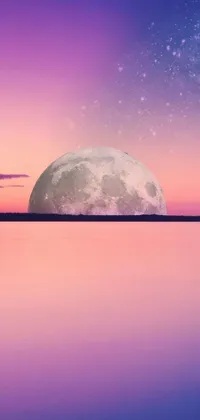 Feast your eyes on this stunning live phone wallpaper featuring a full moon rising over tranquil waters