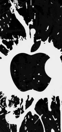 This black and white live wallpaper features an Apple logo as its main focus, surrounded by a mix of artistic elements, such as a picture, graffiti, watercolor splash, and a wallpaper design