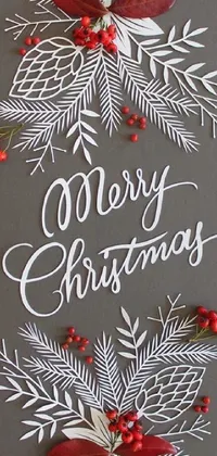 Looking for a beautiful and elegant Christmas live wallpaper? Check out this stunning design featuring a classic holiday greeting of "Merry Christmas" written in bold letters! Created using the unique texture of paper cut art, this vibrant wallpaper is perfect for adding a festive touch to your phone's display