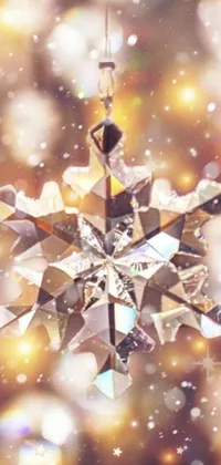 This live wallpaper features a snowflake ornament hanging from a string in a crystal cubism style, with Instagram filters which add to the modern aesthetic