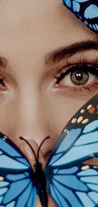 This stunning live wallpaper for your phone features a breathtaking close-up of a person's face, with a beautiful butterfly perched delicately on their cheek