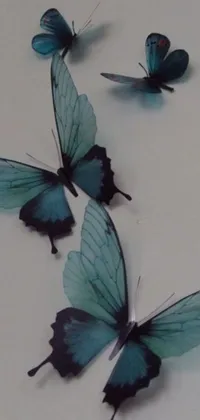 Transform your phone into a breathtaking masterpiece with this stunning live wallpaper featuring a group of blue butterflies