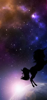 This phone live wallpaper features a galaxy background and a silhouette of a unicorn riding on a horse holding onto the galaxy