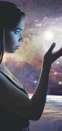 The "Crystal Ball" phone live wallpaper features a stunning digital art image of a woman holding a glowing crystal ball in her hand