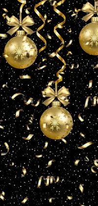 This live wallpaper features festive gold Christmas ornaments and streamers set against a black background with a seamless texture