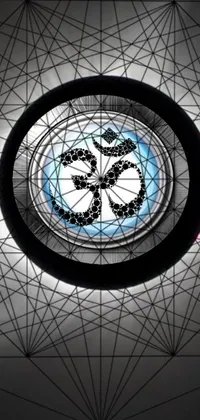 This circular window live phone wallpaper showcases an om symbol with a unique blue outline design