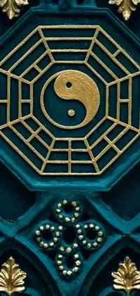 This stunning live wallpaper for your phone features an intricately designed blue and gold door with a prominent yin symbol