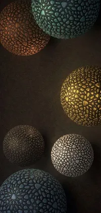 This stunning phone live wallpaper features a 3D render of four balls sitting atop a table in a visually dynamic design