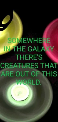 This phone live wallpaper showcases an intergalactic scene, featuring a quote that reads "Somewhere in the galaxy there's creatures that are out of this world