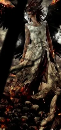 This phone live wallpaper depicts a striking digital art scene of a woman standing on top of a pile of skulls, set against a dark and eerie atmosphere in a burnt forest