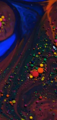 The phone live wallpaper depicts a scrumptious and colorful cake with sprinkles, offering a close-up view inspired by microscopic photography