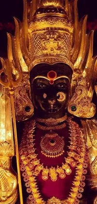 This live wallpaper for your phone features a close-up of a golden statue with intricate black-and-red details, popular in the CG society and Samikshavad communities